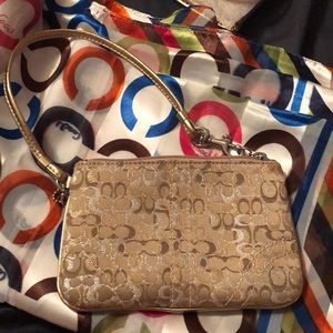 Gold Coach mini wristlet